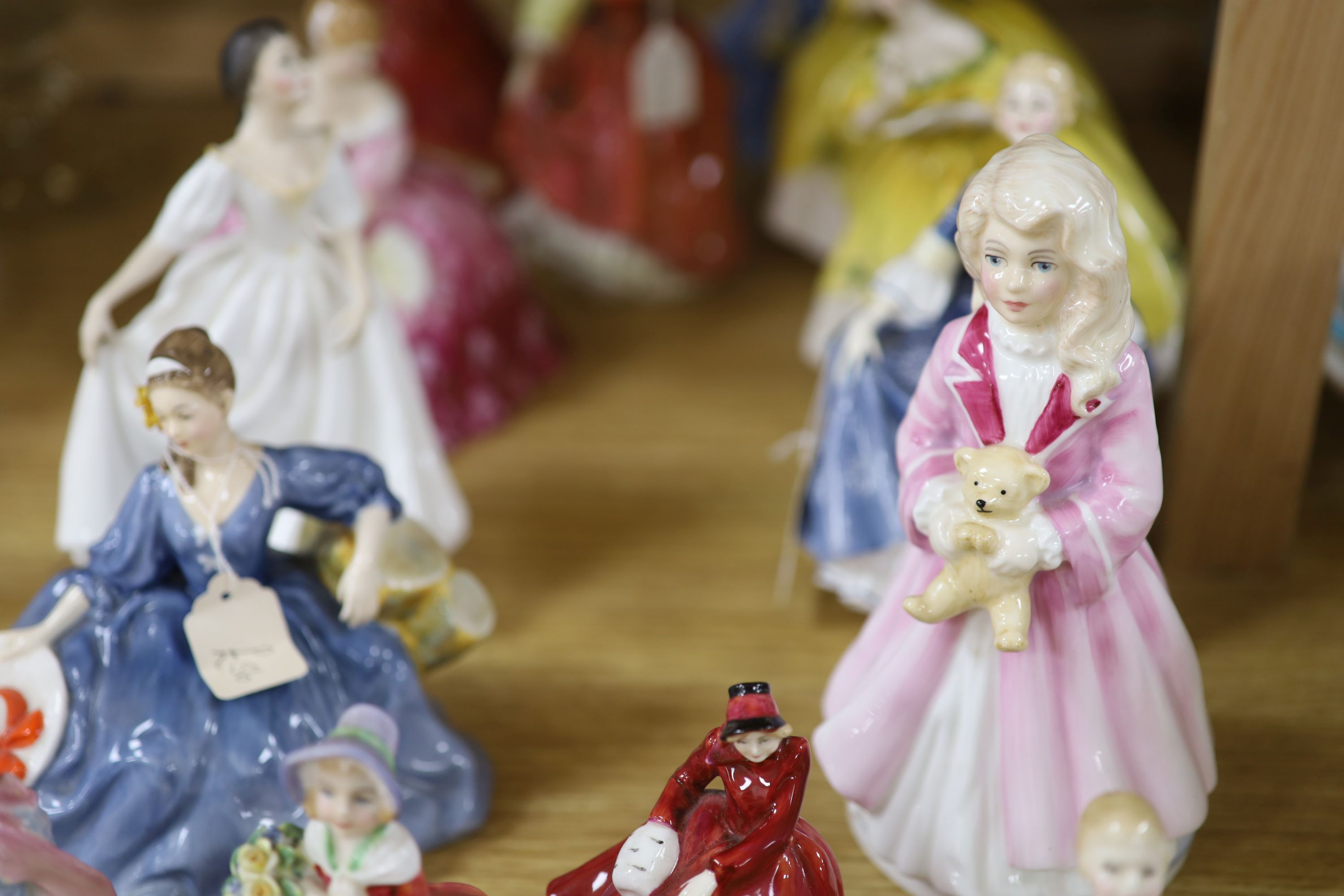 A collection of fourteen Royal Doulton figures